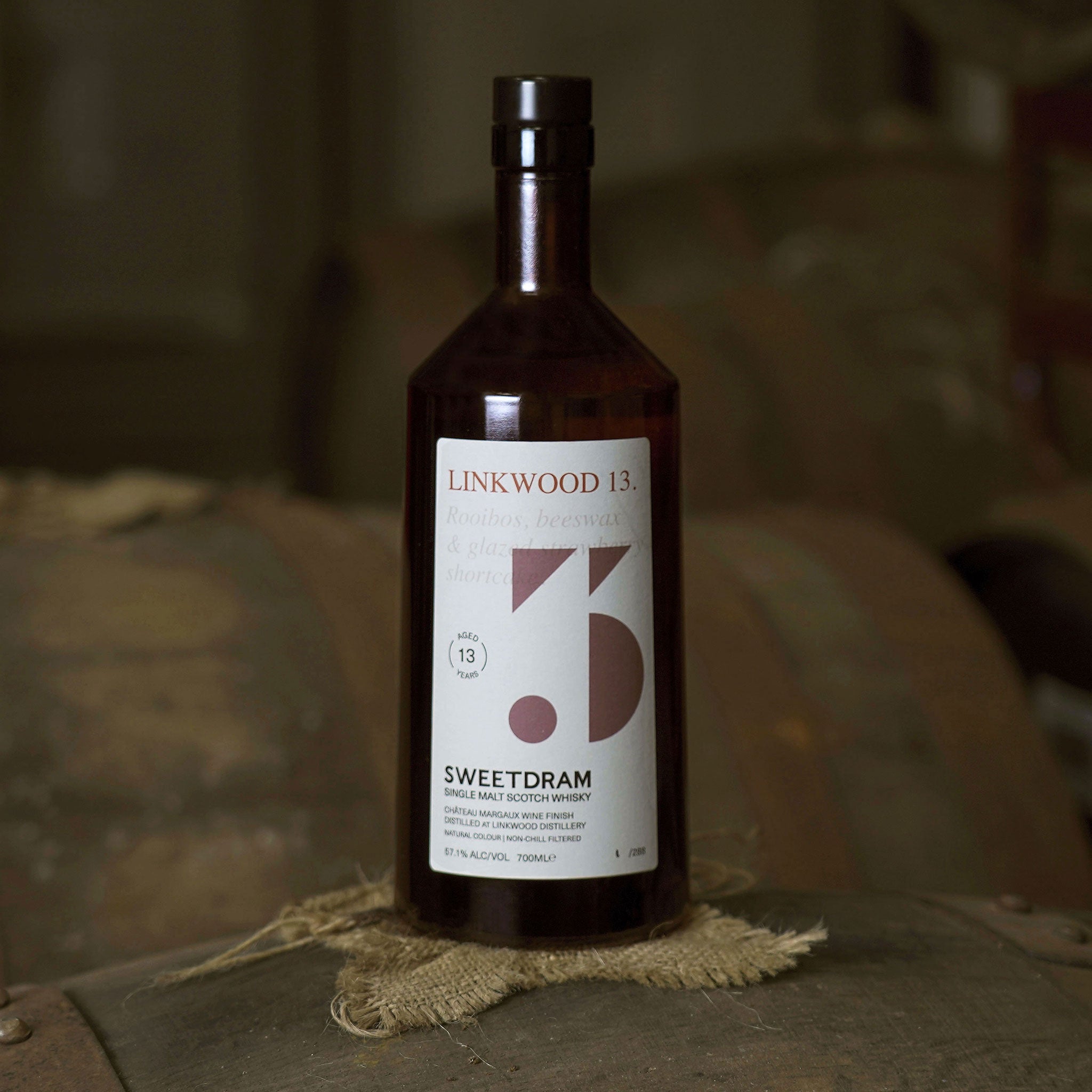 750ml bottle of Linkwood 14-year-old single-cask Whisky sitting on a cask.